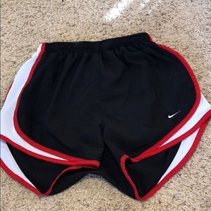 Red and black nike shorts
